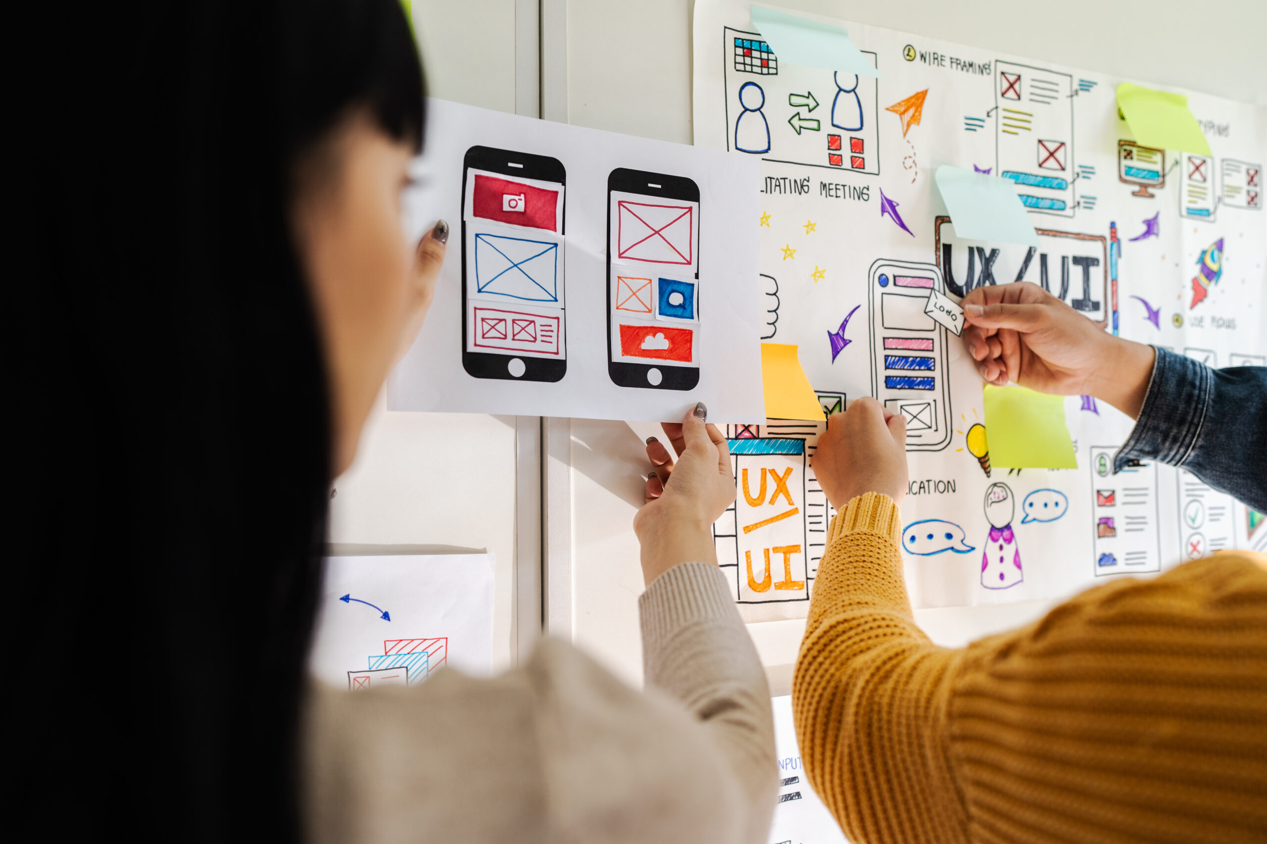 website close up ux developer and ui designer brainstorming interface wireframe design.creative digital development agency